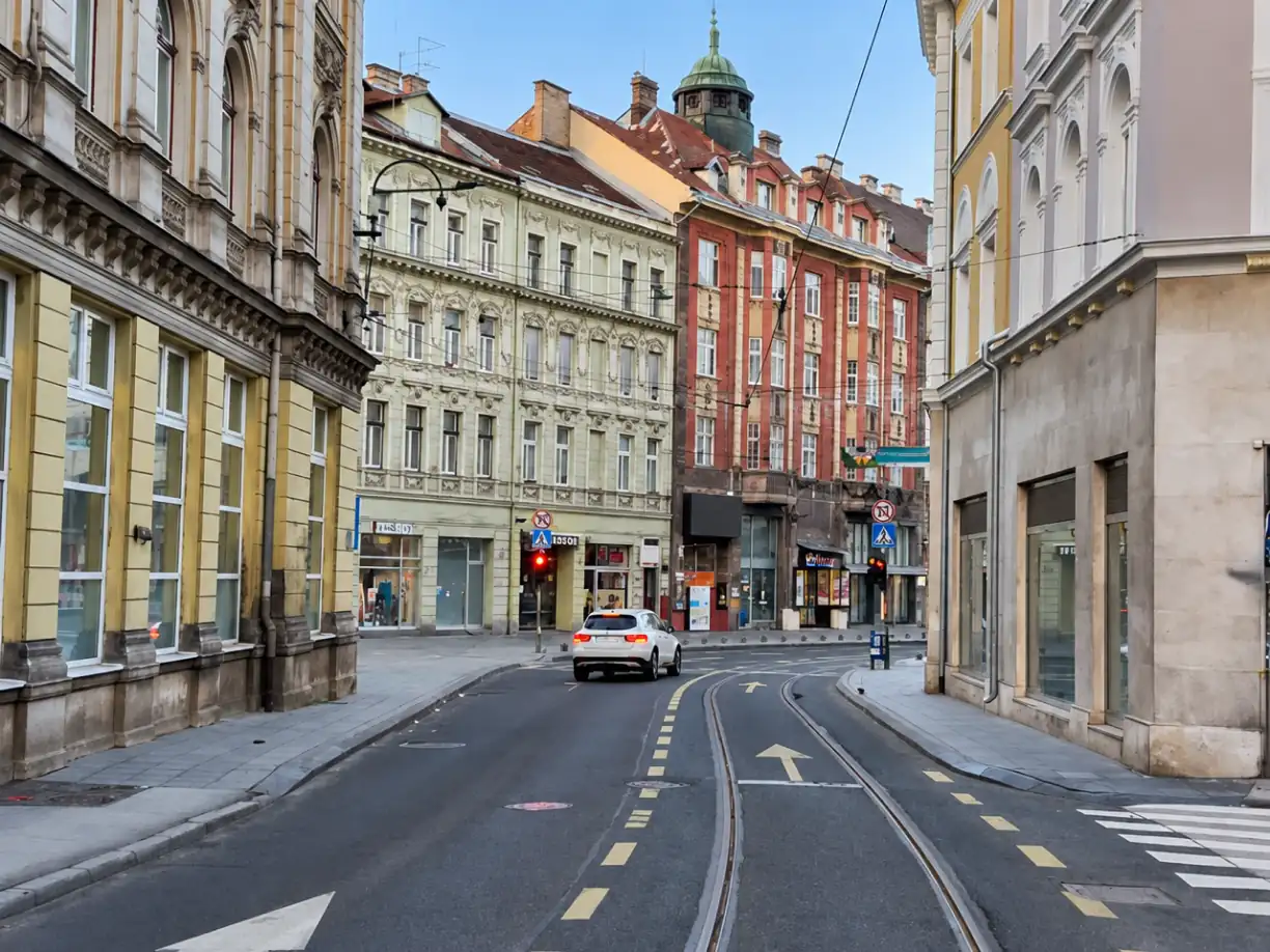 Tram street in central Sarajevo with historic shopfront facades near Hotel Cosmopolit